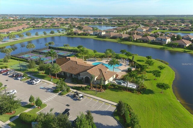 bird's eye view with a residential view and a water view