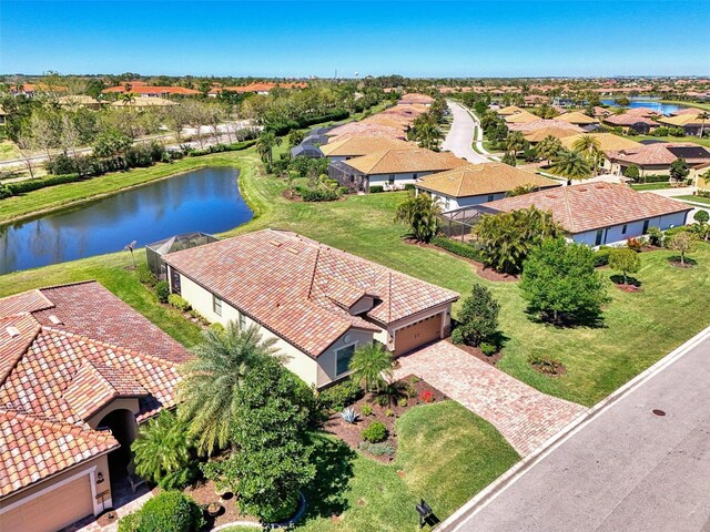birds eye view of property featuring a residential view and a water view