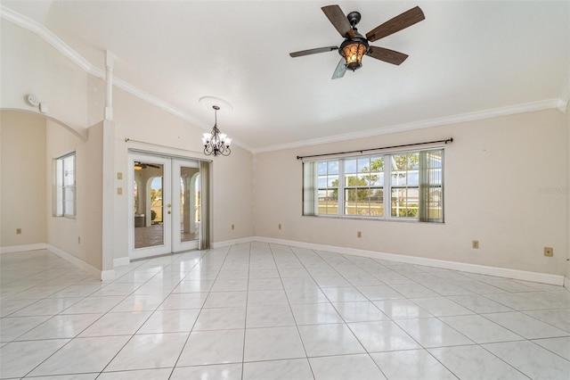 spare room featuring vaulted ceiling, french doors, arched walkways, and ornamental molding