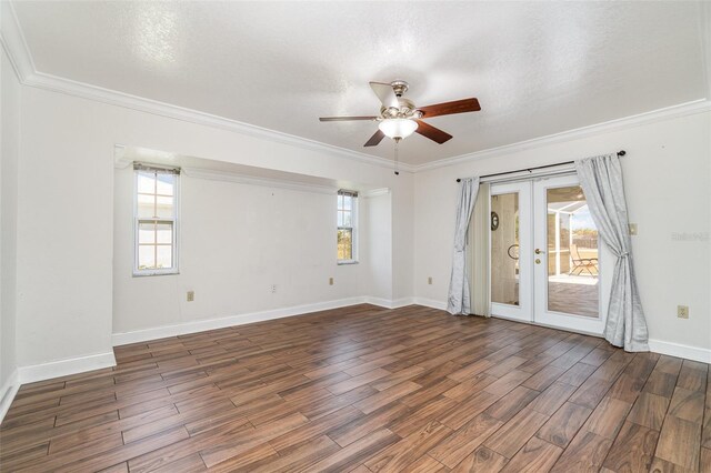 unfurnished room featuring french doors, plenty of natural light, wood finished floors, and a ceiling fan