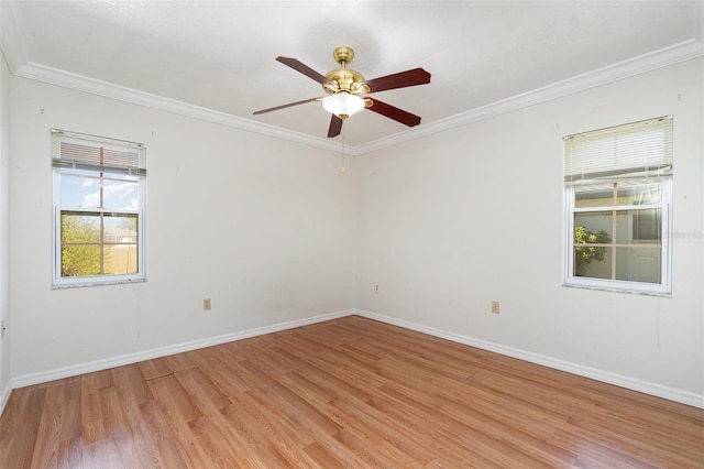 unfurnished room featuring light wood-type flooring and crown molding