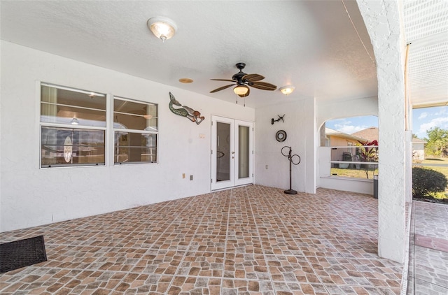 view of patio / terrace with a ceiling fan, french doors, and visible vents