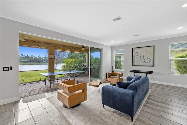 5954 Anise Dr, Sarasota, FL 34238 - living area featuring crown molding, a water view, and recessed lighting