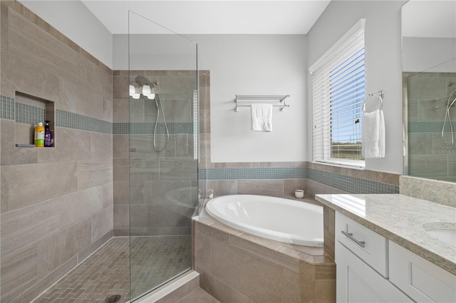 5954 Anise Dr, Sarasota, FL 34238 - bathroom with a garden tub, vanity, and tiled shower