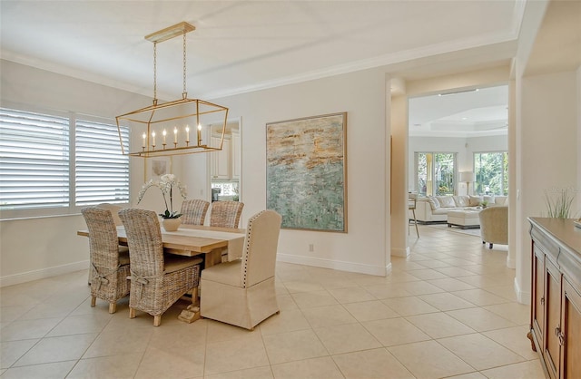 7137 Orchid Island Pl, Bradenton, FL 34202 - dining room with crown molding, an inviting chandelier, baseboards, and light tile patterned floors