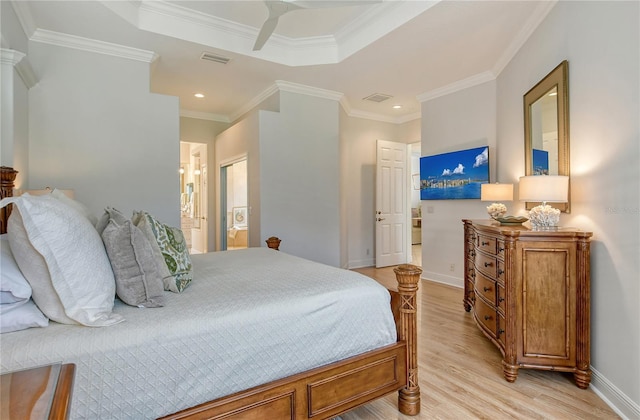 7137 Orchid Island Pl, Bradenton, FL 34202 - bedroom with crown molding, visible vents, light wood-style flooring, and baseboards
