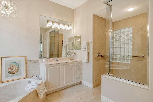 7137 Orchid Island Pl, Bradenton, FL 34202 - full bathroom with a garden tub, tiled shower, vanity, tile patterned floors, and a notable chandelier