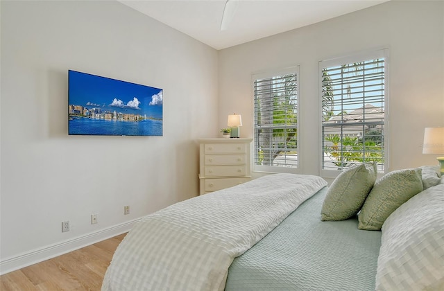 7137 Orchid Island Pl, Bradenton, FL 34202 - bedroom featuring baseboards and light wood-type flooring