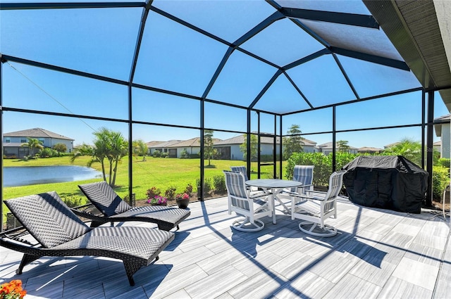 5129 Marina Basin Ct, Bradenton, FL 34211 - view of patio / terrace with area for grilling, glass enclosure, a residential view, and a deck with water view