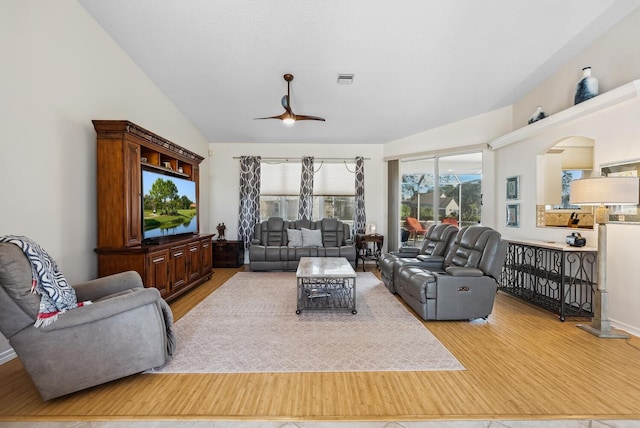2439 Sonoma Dr W, Nokomis, FL 34275 - living room featuring wood finished floors, ceiling fan, and vaulted ceiling