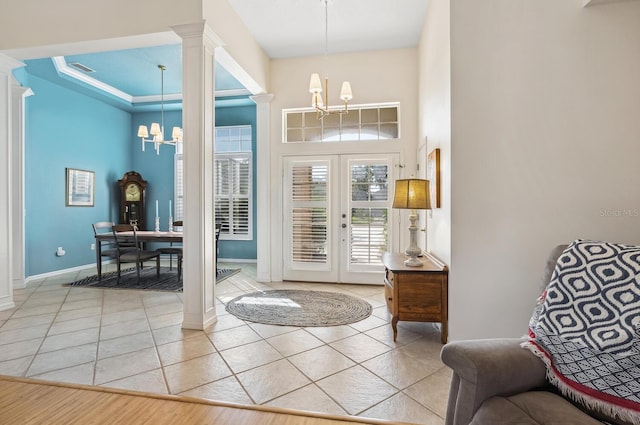 2439 Sonoma Dr W, Nokomis, FL 34275 - entryway with a chandelier, light tile patterned flooring, an office area, baseboards, and a towering ceiling