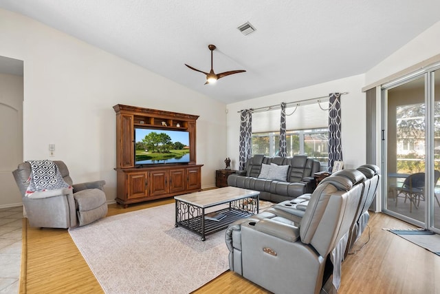 2439 Sonoma Dr W, Nokomis, FL 34275 - living room featuring plenty of natural light, a ceiling fan, lofted ceiling, and light wood-style floors