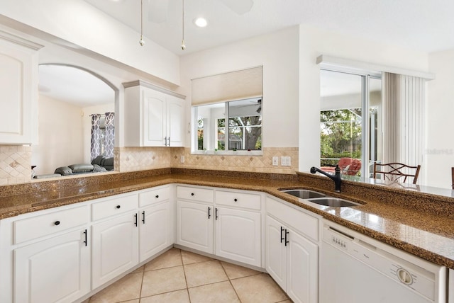 2439 Sonoma Dr W, Nokomis, FL 34275 - kitchen featuring a sink, dishwasher, dark stone counters, tasteful backsplash, and recessed lighting