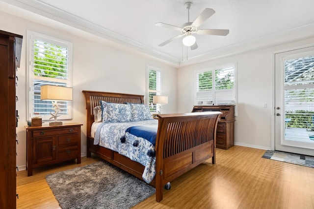 2439 Sonoma Dr W, Nokomis, FL 34275 - bedroom featuring light wood-style flooring, access to exterior, crown molding, baseboards, and ceiling fan