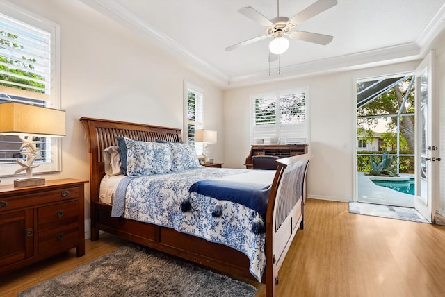 2439 Sonoma Dr W, Nokomis, FL 34275 - bedroom featuring light wood finished floors, access to outside, ornamental molding, a ceiling fan, and baseboards
