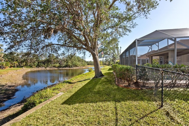 2439 Sonoma Dr W, Nokomis, FL 34275 - view of green lawn with a water view and a lanai