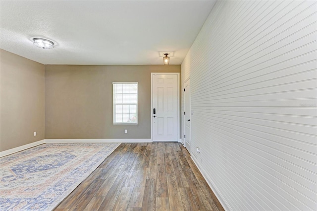10614 Morning Marsh Ln, Parrish, FL 34219 - unfurnished room featuring dark wood-style floors and baseboards
