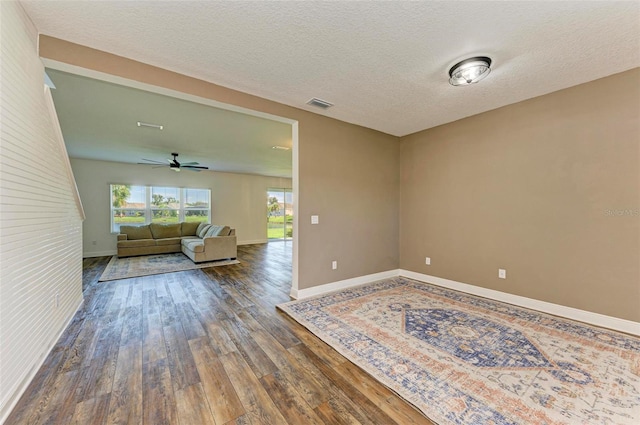 10614 Morning Marsh Ln, Parrish, FL 34219 - empty room featuring hardwood / wood-style flooring, ceiling fan, and a textured ceiling