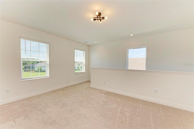 10614 Morning Marsh Ln, Parrish, FL 34219 - spare room featuring light colored carpet and recessed lighting