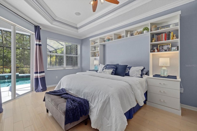 259 Golden Harbour Trl, Bradenton, FL 34212 - bedroom with a raised ceiling, crown molding, baseboards, and light wood finished floors