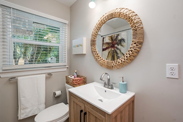 full bathroom featuring toilet and vanity
