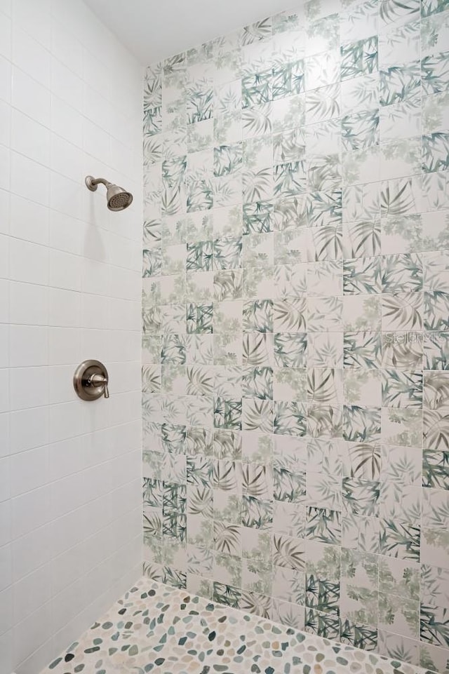 bathroom with tiled shower