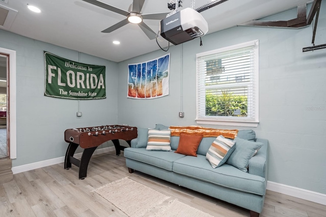 living room with a ceiling fan, recessed lighting, baseboards, and wood finished floors
