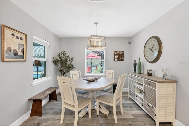 145 Baytree Dr, Rotonda West, FL 33947 - dining room featuring wood finished floors and baseboards