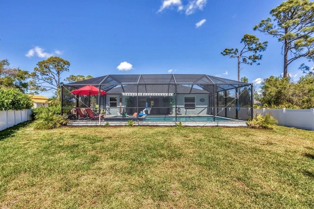 145 Baytree Dr, Rotonda West, FL 33947 - back of house featuring a lanai