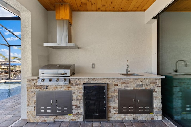 view of patio featuring a lanai, a grill, wine cooler, a sink, and area for grilling