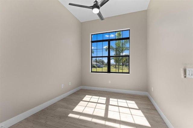 empty room with baseboards, light wood finished floors, and ceiling fan