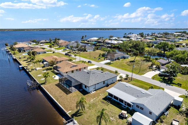 bird's eye view with a water view and a residential view