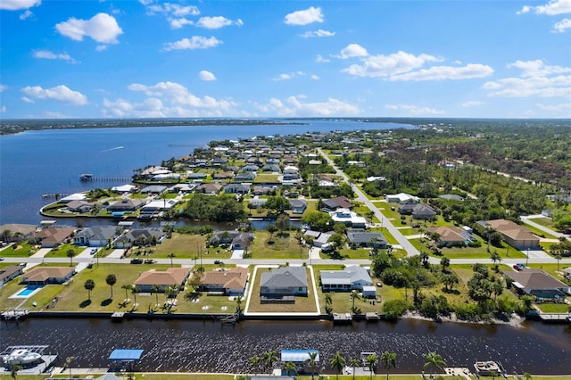 aerial view featuring a water view and a residential view