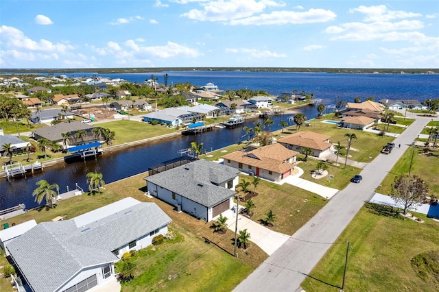 aerial view with a residential view and a water view