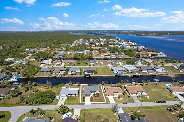 aerial view with a residential view and a water view