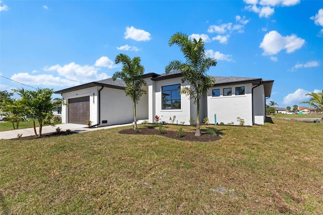prairie-style house featuring stucco siding, concrete driveway, a garage, and a front lawn