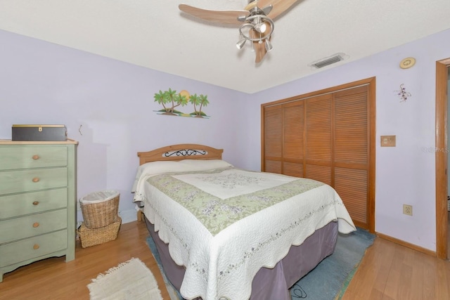 2070 59th St, Sarasota, FL 34243 - bedroom with wood finished floors, a closet, and ceiling fan