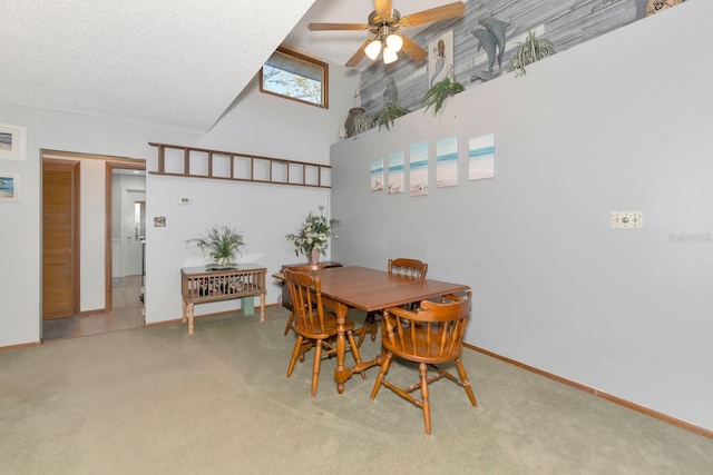 2070 59th St, Sarasota, FL 34243 - dining space featuring a ceiling fan, carpet flooring, and a high ceiling