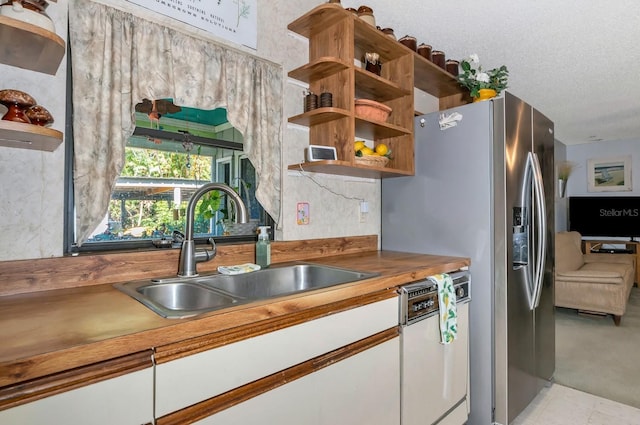 2070 59th St, Sarasota, FL 34243 - kitchen featuring white dishwasher, white cabinets, open shelves, decorative backsplash, and stainless steel refrigerator with ice dispenser