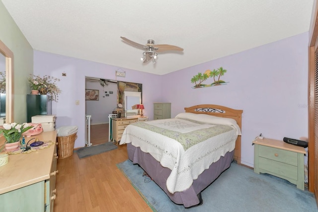 2070 59th St, Sarasota, FL 34243 - bedroom featuring light wood finished floors and a ceiling fan
