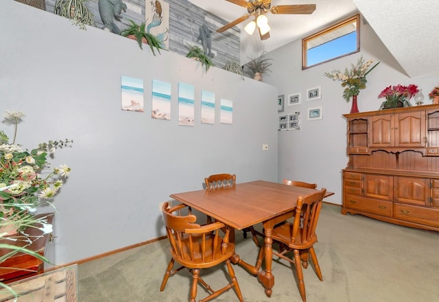 2070 59th St, Sarasota, FL 34243 - dining room with light colored carpet, a ceiling fan, and a towering ceiling