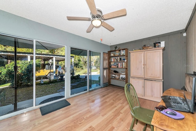 2070 59th St, Sarasota, FL 34243 - office area featuring light wood finished floors, a ceiling fan, and a textured ceiling