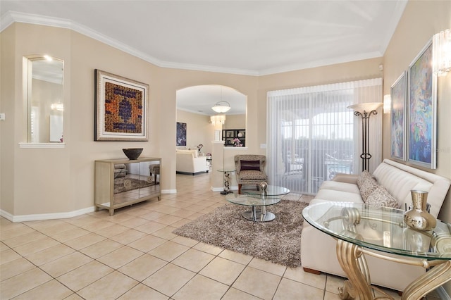 12211 Aster Ave, Bradenton, FL 34212 - tiled living room featuring baseboards, arched walkways, and crown molding