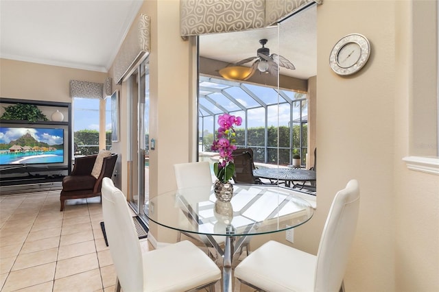 12211 Aster Ave, Bradenton, FL 34212 - dining area featuring tile patterned flooring, ornamental molding, a ceiling fan, and a sunroom