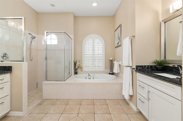 12211 Aster Ave, Bradenton, FL 34212 - bathroom with tile patterned flooring, a garden tub, vanity, and a walk in shower