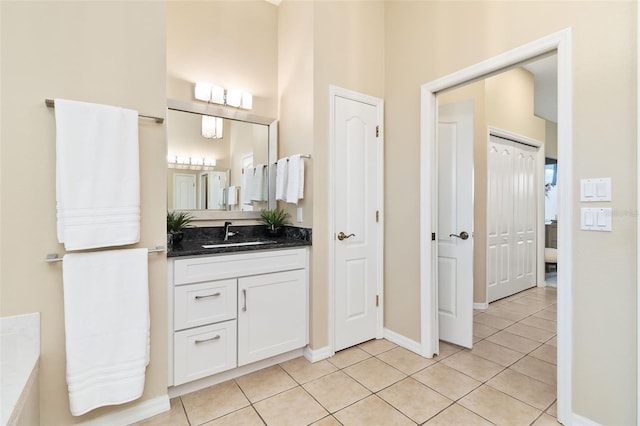12211 Aster Ave, Bradenton, FL 34212 - bathroom with baseboards, vanity, and tile patterned flooring