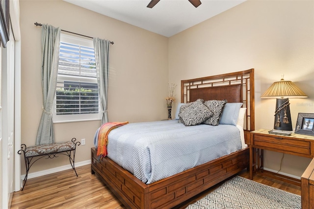 12211 Aster Ave, Bradenton, FL 34212 - bedroom featuring a ceiling fan, wood finished floors, and baseboards