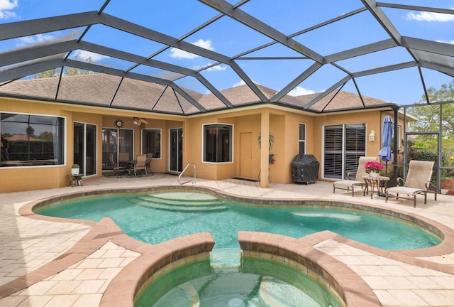 12211 Aster Ave, Bradenton, FL 34212 - view of swimming pool with a patio, a ceiling fan, a pool with connected hot tub, grilling area, and a lanai