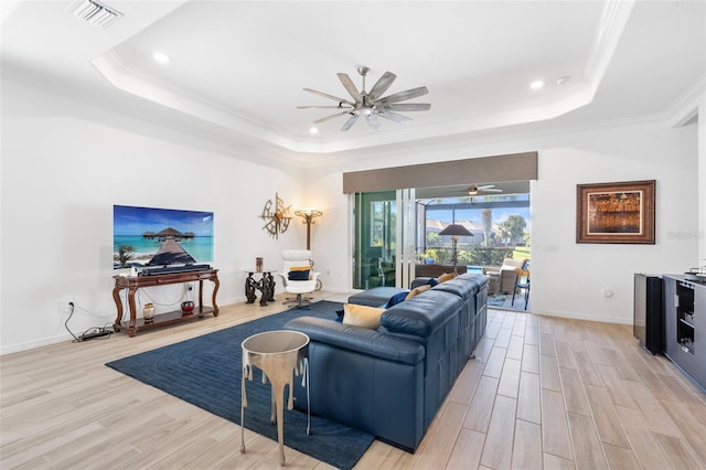 25325 Longmeadow Dr, Punta Gorda, FL 33955 - living area featuring a tray ceiling, light wood-style floors, visible vents, and ceiling fan