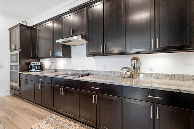 25325 Longmeadow Dr, Punta Gorda, FL 33955 - kitchen with light stone countertops, appliances with stainless steel finishes, under cabinet range hood, crown molding, and light wood-type flooring